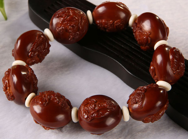 百匠诀核雕使用方法,橄榄核雕的盘玩方法