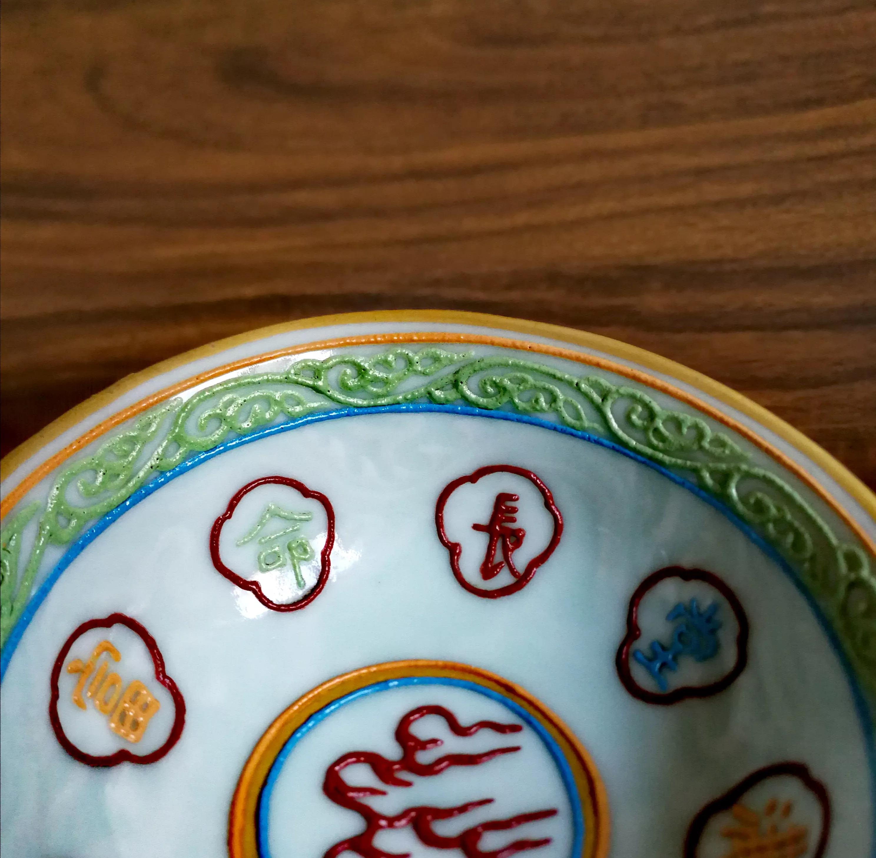 乾隆年制祭红釉珐琅彩高足杯价值,明代民窑青花瓷鸟纹压手杯