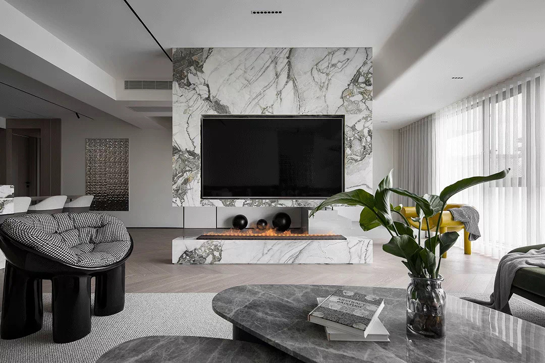 鹏基艺术石材:电视墙用岩板好还是石材好